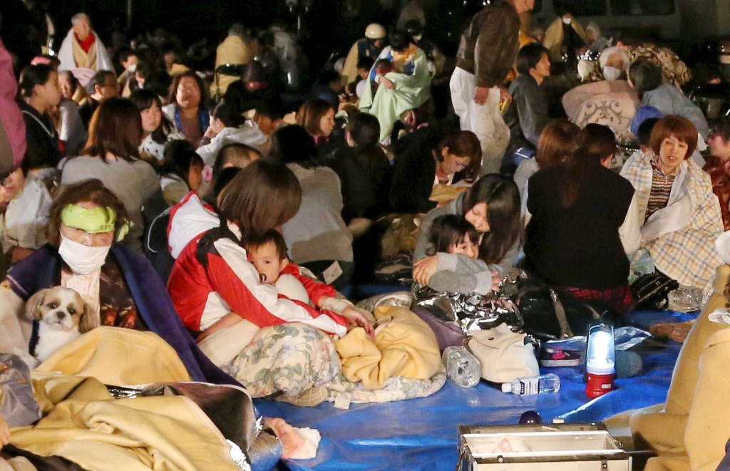 Evacuees gather in front of town office building after an earthquake in Mashiki town, Kumamoto prefecture, southern Japan